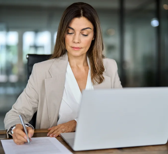 Professional woman organising business travel at a trusted corporate travel agency